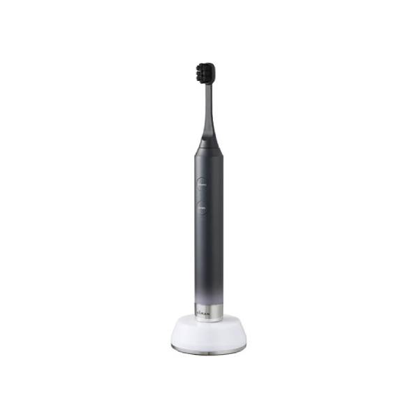 A sleek electric toothbrush with a dark gray handle and black bristles, resting on a white charging base against a solid white background.